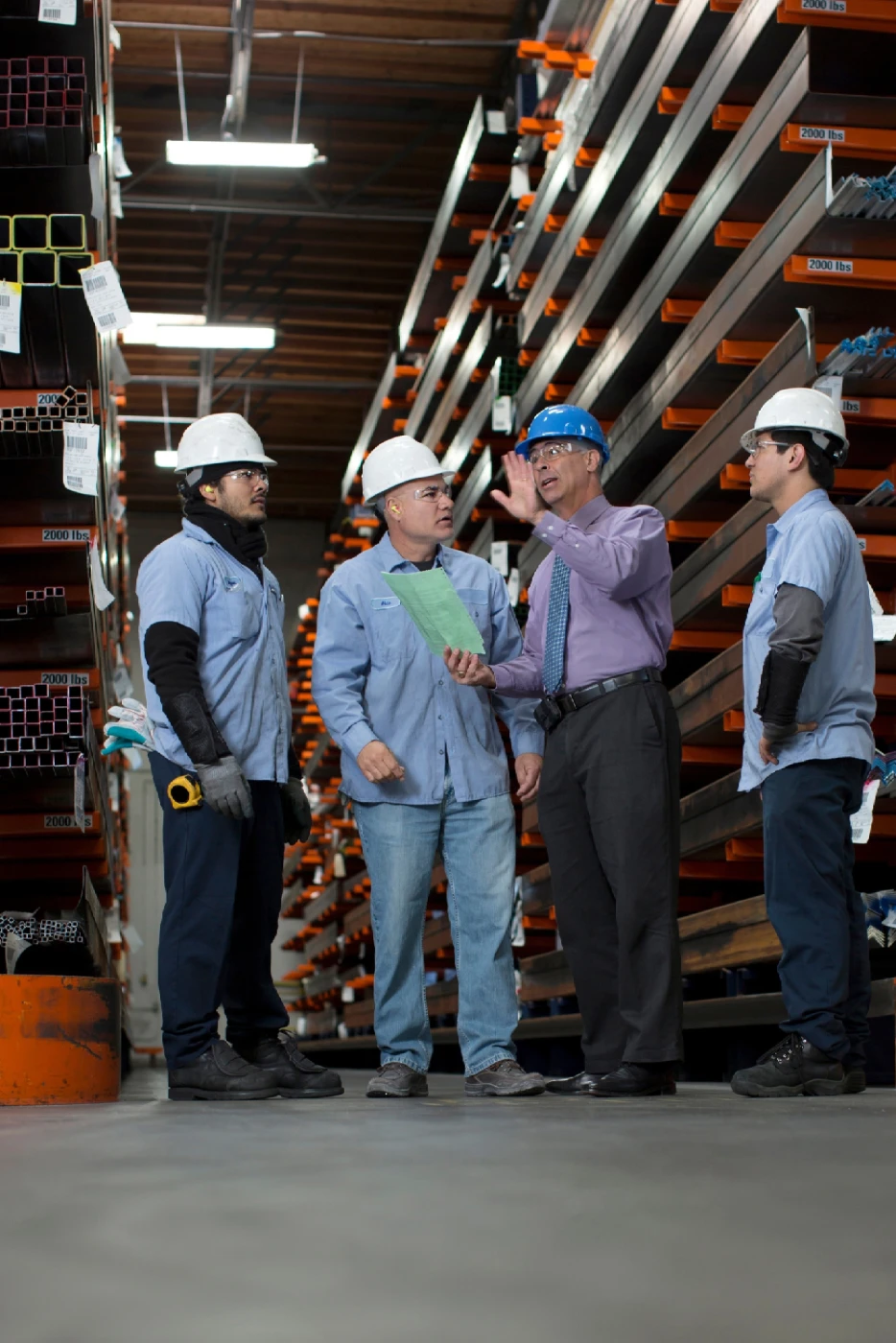 Executive discussion steel factory floor